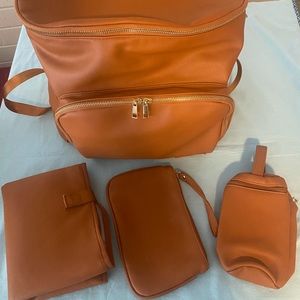 Upper New York Backpack Diaper bag with changing pad, pouch, and bottle bag